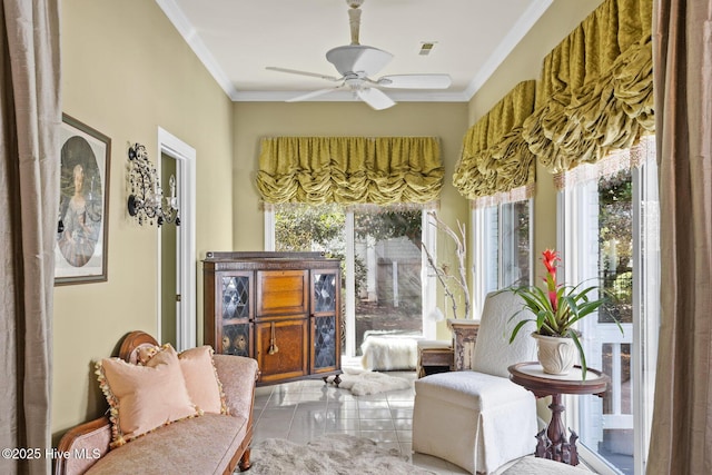 sunroom featuring visible vents and ceiling fan