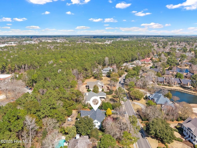 bird's eye view with a residential view and a wooded view