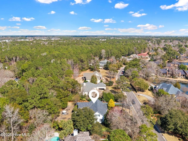 bird's eye view with a residential view and a wooded view