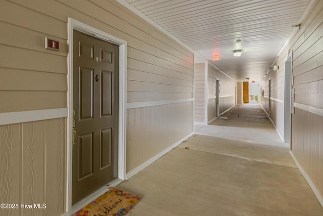 hallway with wooden walls