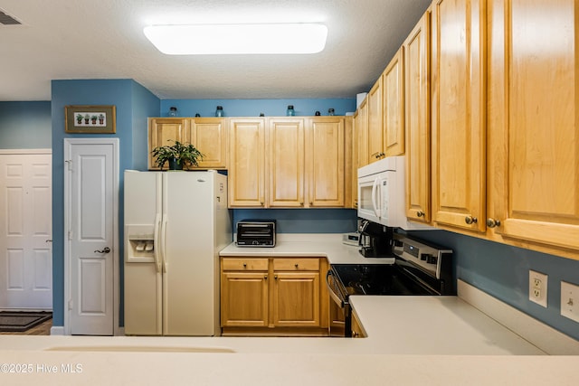 kitchen featuring a textured ceiling, a toaster, white appliances, visible vents, and light countertops