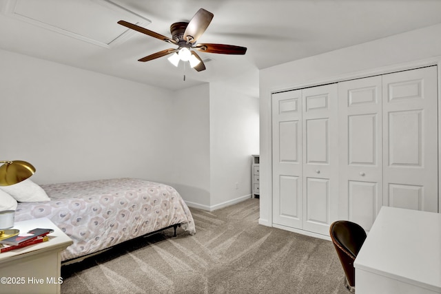 bedroom featuring a ceiling fan, carpet flooring, baseboards, and a closet