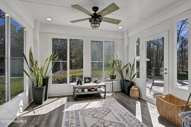 sunroom / solarium featuring ceiling fan