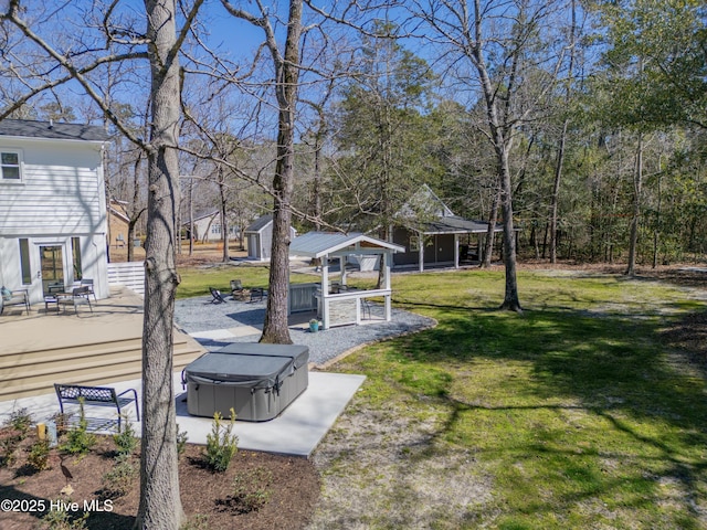 view of yard with a patio and a hot tub