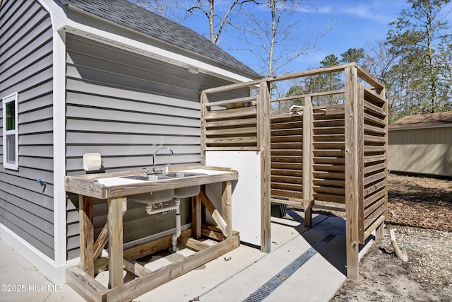 exterior space with an outbuilding, stairway, and a storage shed