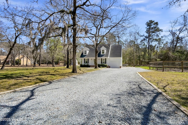 cape cod house with a garage, gravel driveway, a front yard, and fence