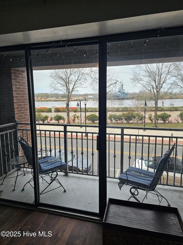 balcony featuring a water view