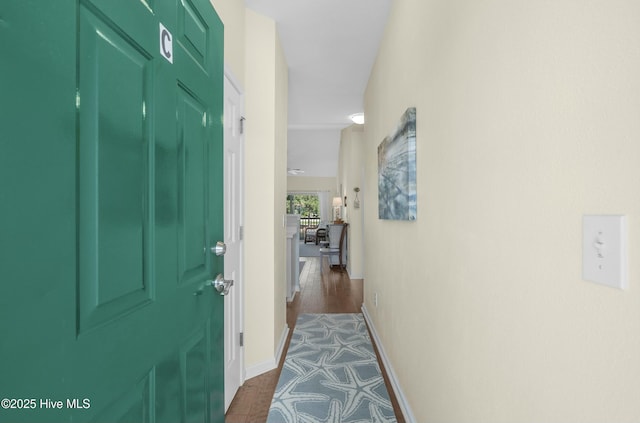 corridor featuring baseboards