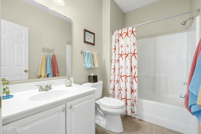 full bathroom featuring shower / tub combo with curtain, vanity, toilet, and tile patterned floors