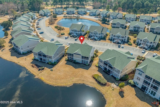 aerial view featuring a water view and a residential view