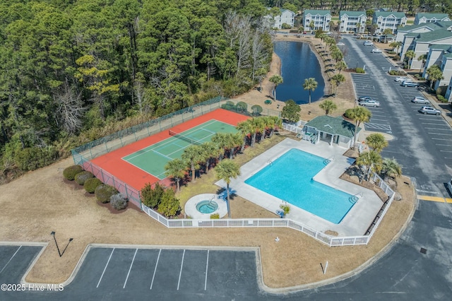 birds eye view of property featuring a water view