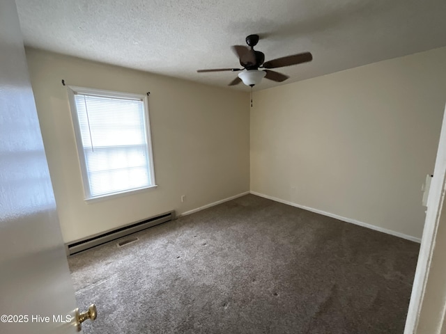 spare room featuring a ceiling fan, a textured ceiling, carpet floors, baseboards, and baseboard heating