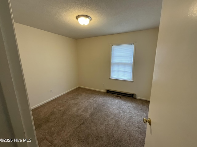 unfurnished room featuring baseboards, carpet, visible vents, and a textured ceiling