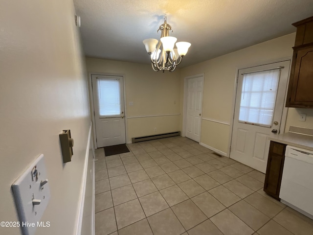 unfurnished dining area featuring visible vents, light tile patterned floors, baseboard heating, a notable chandelier, and a textured ceiling