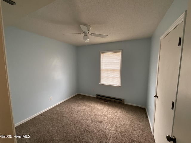 unfurnished bedroom featuring ceiling fan, a textured ceiling, baseboards, and carpet floors