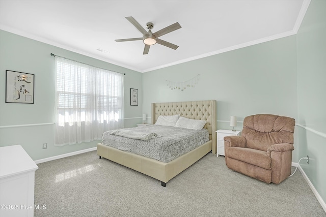 bedroom with ceiling fan, baseboards, carpet floors, and ornamental molding