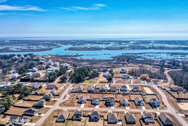 birds eye view of property featuring a residential view and a water view