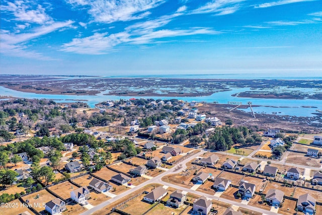 bird's eye view featuring a residential view and a water view