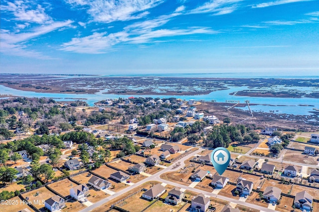 birds eye view of property featuring a residential view and a water view