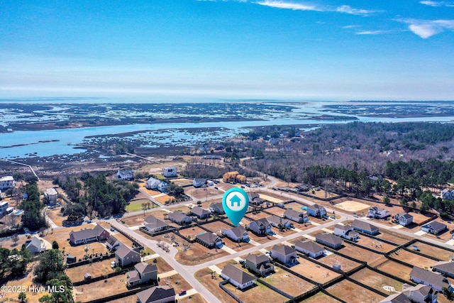 bird's eye view featuring a residential view and a water view