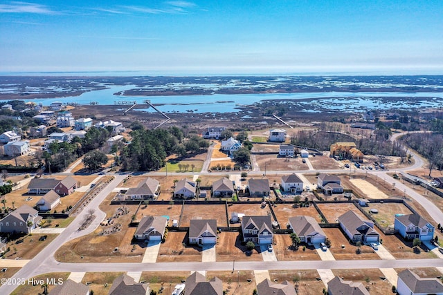 bird's eye view featuring a residential view and a water view