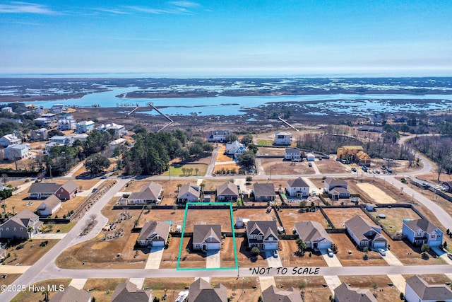 birds eye view of property featuring a residential view and a water view