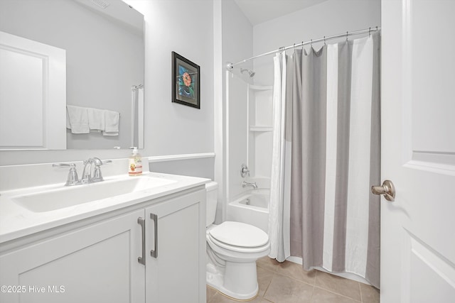 full bath featuring tile patterned flooring, toilet, vanity, and shower / bath combo