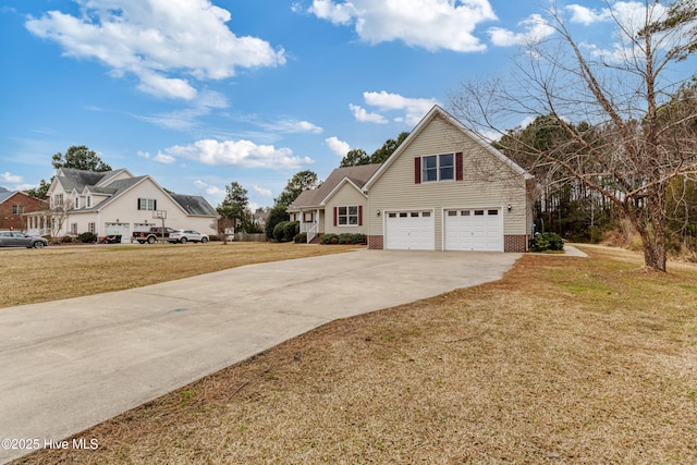 traditional home featuring concrete driveway, a front yard, and a garage