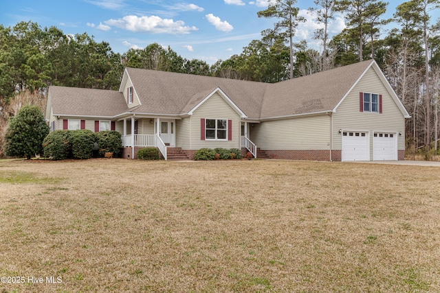 view of front facade with a front yard, driveway, a garage, and roof with shingles