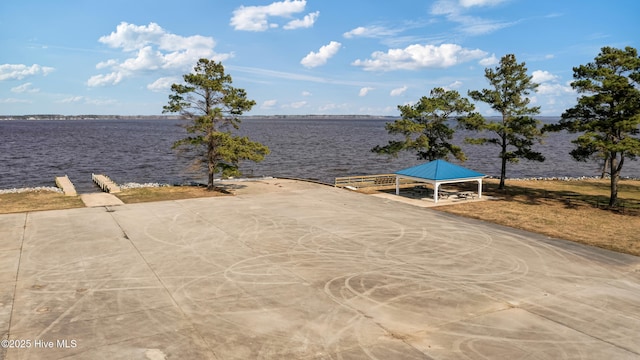 view of dock featuring a water view and a gazebo