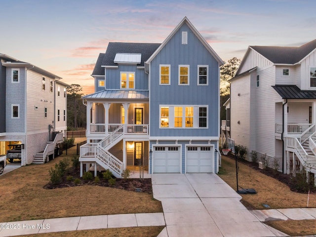 view of front of house with a porch, board and batten siding, stairs, and a standing seam roof