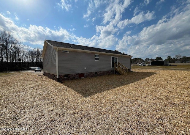 back of house with crawl space