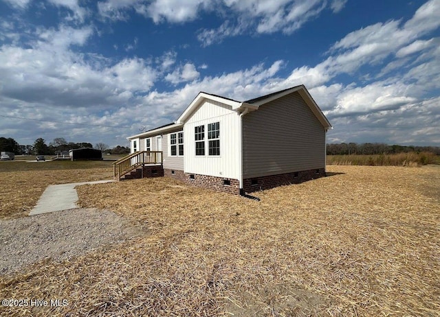 view of side of property featuring crawl space