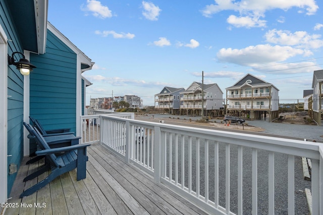 wooden terrace with a residential view