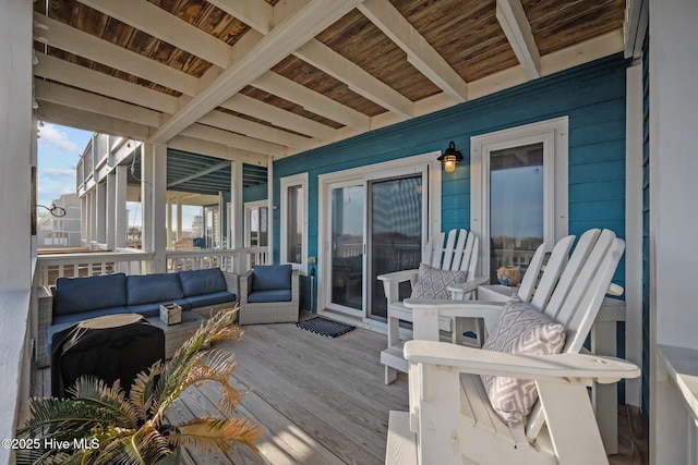 wooden terrace featuring outdoor lounge area