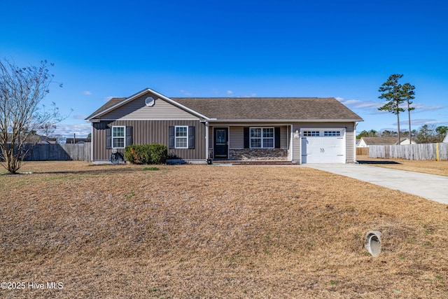 single story home featuring an attached garage, fence, board and batten siding, and driveway