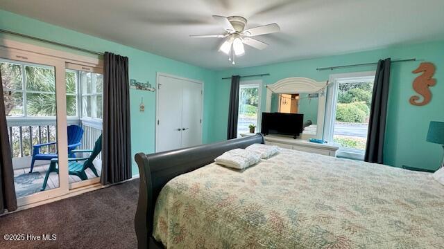 carpeted bedroom with a ceiling fan