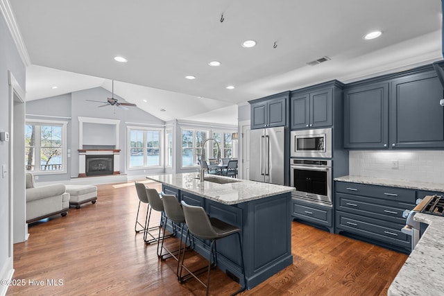 kitchen featuring visible vents, a sink, appliances with stainless steel finishes, a healthy amount of sunlight, and ceiling fan