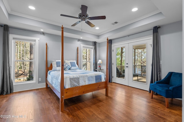 bedroom with visible vents, french doors, and a tray ceiling