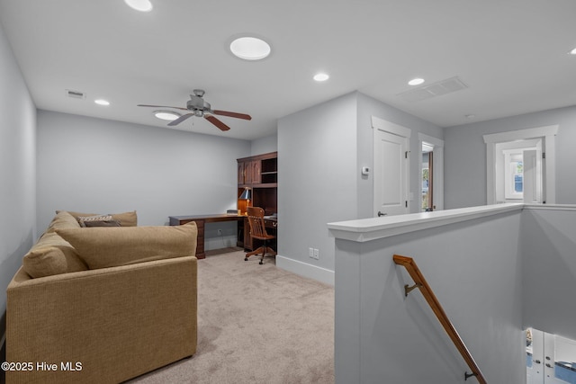 living area with visible vents, baseboards, light colored carpet, recessed lighting, and a ceiling fan