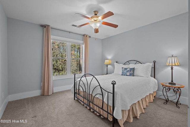 bedroom with visible vents, baseboards, carpet, and ceiling fan