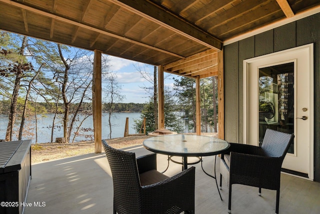 view of patio / terrace featuring outdoor dining area and a water view