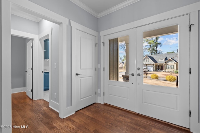 foyer entrance featuring french doors, ornamental molding, and dark wood finished floors