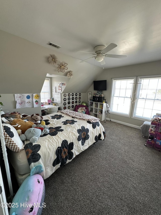 carpeted bedroom featuring ceiling fan, baseboards, visible vents, and vaulted ceiling