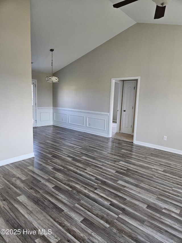 410 Bristol Ln, Hubert, NC 28539 - unfurnished room with ceiling fan, high vaulted ceiling, dark wood-type flooring, a wainscoted wall, and a decorative wall