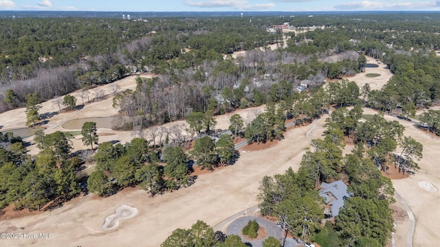 bird's eye view featuring a wooded view