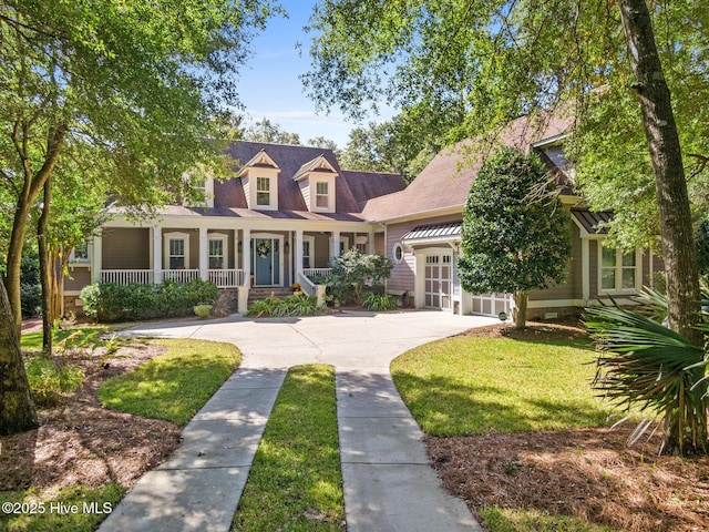 view of front of house featuring covered porch, concrete driveway, and an attached garage