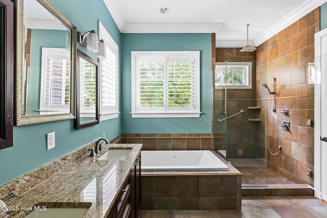 full bath featuring crown molding, a bath, a stall shower, and a sink