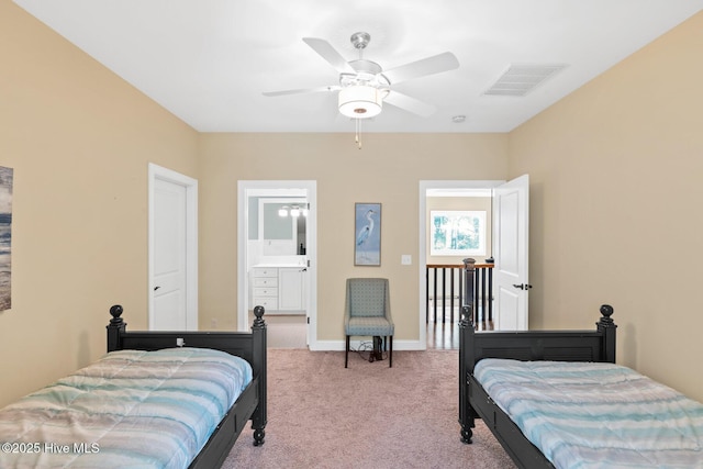 bedroom with carpet, visible vents, baseboards, ceiling fan, and ensuite bathroom