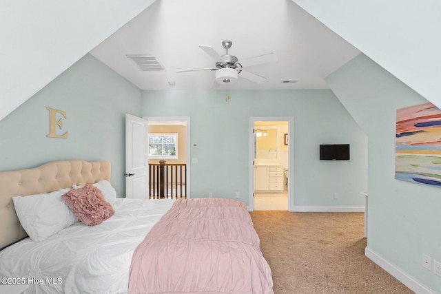 carpeted bedroom with visible vents, baseboards, ceiling fan, and ensuite bathroom